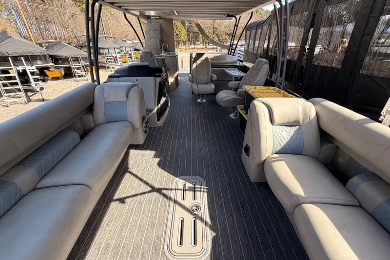 Slide: The Image of Interior of 2022 Premier 350 Escalante pontoon boat with luxurious seating and modern design. - 18