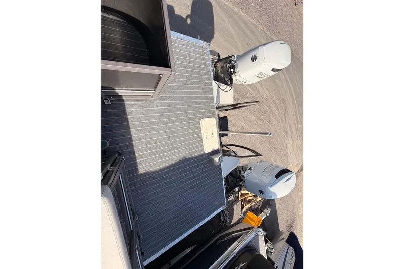 Slide: The Image of 2022 Premier 350 Escalante boat with dual Suzuki outboard motors, rear deck view. - 4