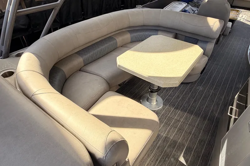 Slide: The Image of Luxurious seating area in 2022 Premier 350 Escalante pontoon boat with table. - 7