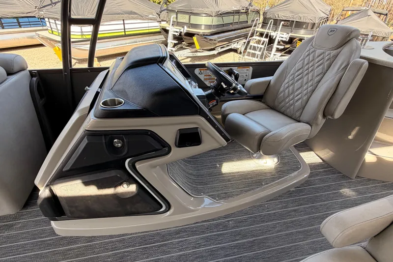 Slide: The Image of Luxurious helm of 2022 Premier 350 Escalante pontoon boat with plush captain's chair. - 8