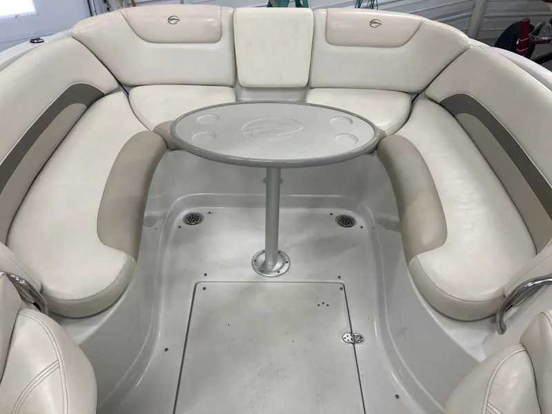 Slide: The Image of Interior of a 2009 Crownline 240LS Bowrider with seating area. - 14