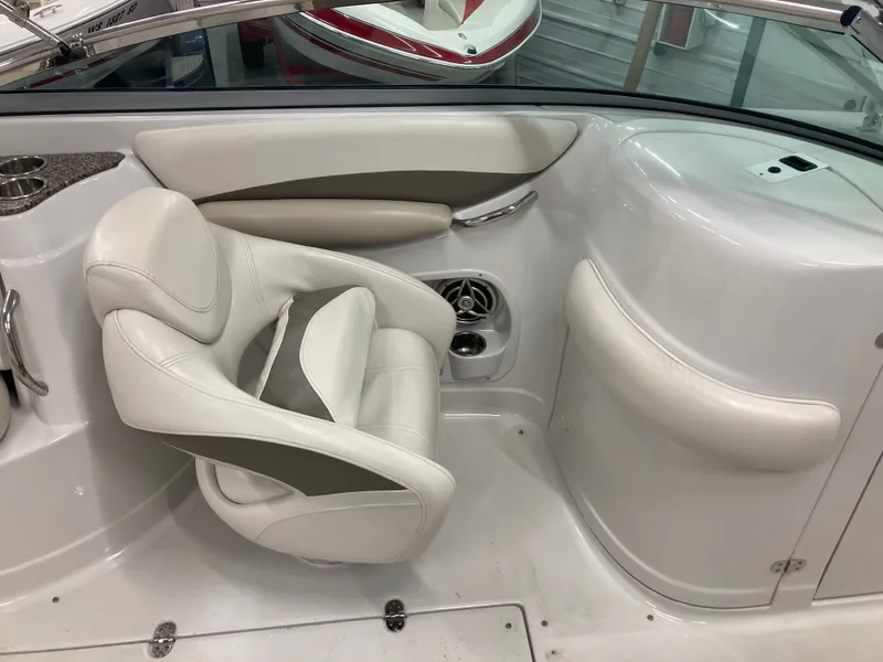 Slide: The Image of Interior of a 2009 Crownline 240LS Bowrider with white seating. - 24