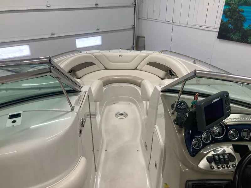 Slide: The Image of Interior view of a 2009 Crownline 240LS Bowrider boat. - 26