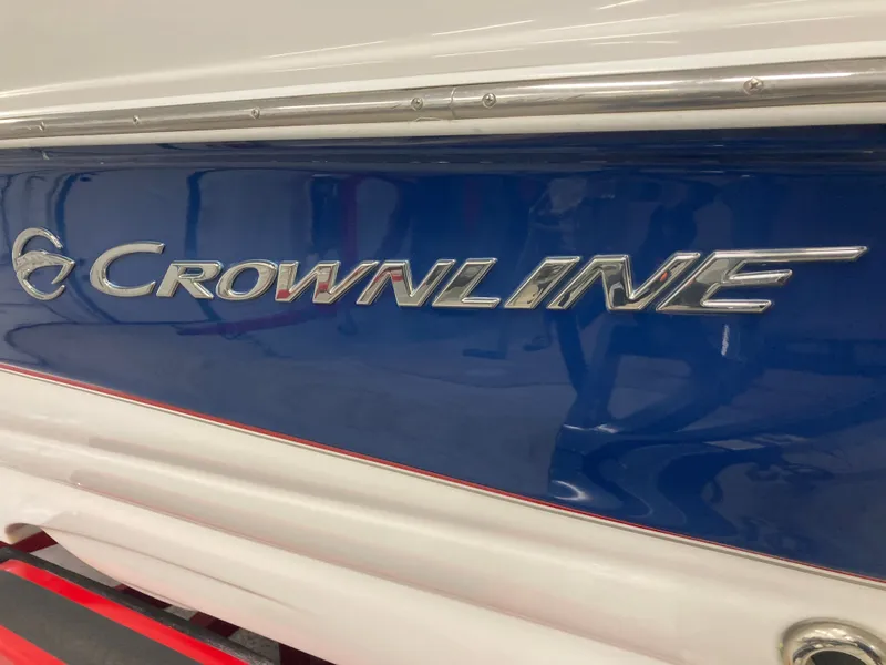 Slide: The Image of Crownline 240LS Bowrider 2009 boat, blue and white design. - 32