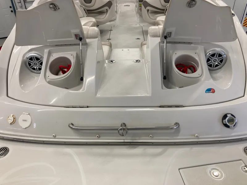 Slide: The Image of Rear view of 2009 Crownline 240LS Bowrider with speakers and storage compartments. - 6