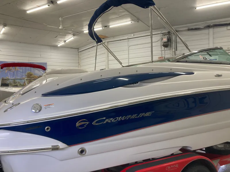 Slide: The Image of 2009 Crownline 240LS Bowrider in a storage facility. - 7