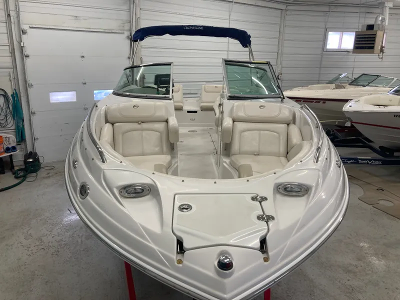 Slide: The Image of 2009 Crownline 240LS Bowrider in a garage, front view. - 9