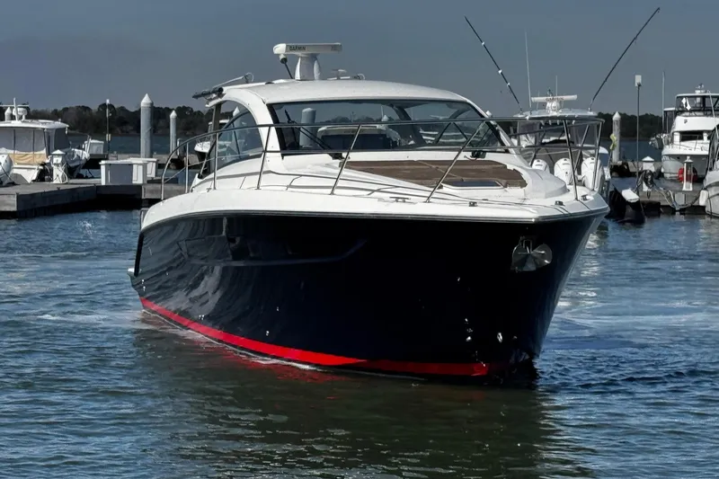 Slide: The Image of 2014 Pursuit SC 365i Sport Coupe yacht docked in marina. - 10