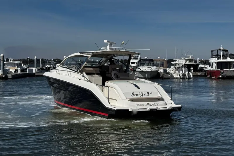 Slide: The Image of 2014 Pursuit SC 365i Sport Coupe yacht docked at marina, Hilton Head Island. - 13