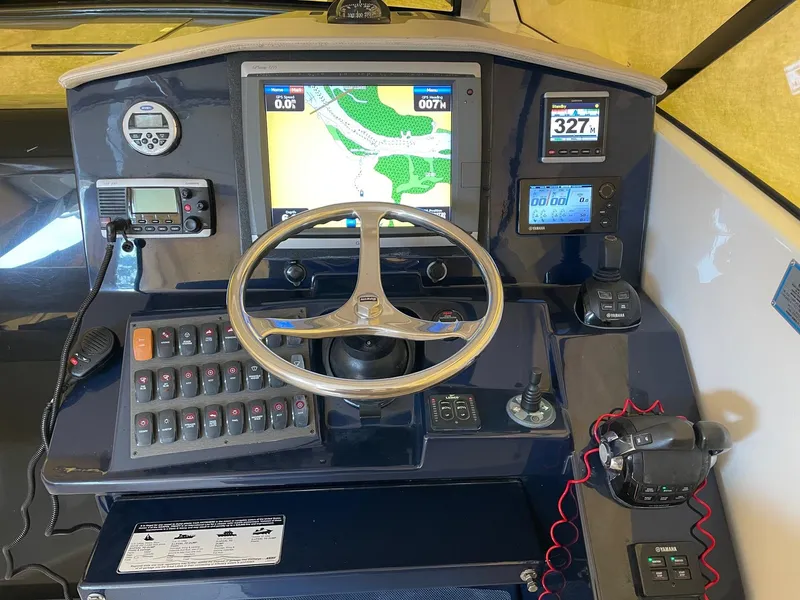 Slide: The Image of Control panel of 2014 Pursuit SC 365i Sport Coupe with navigation and communication systems. - 17