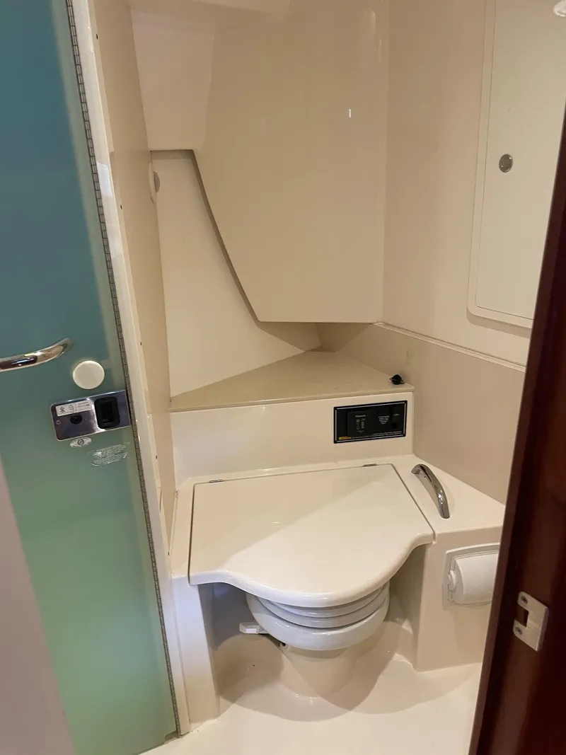 Slide: The Image of 2014 Pursuit SC 365i Sport Coupe bathroom with modern toilet and sleek design. - 28