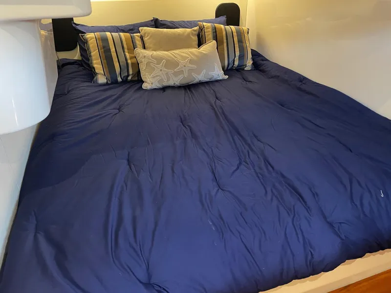 Slide: The Image of Luxurious bed with blue bedding in 2014 Pursuit SC 365i Sport Coupe cabin. - 29