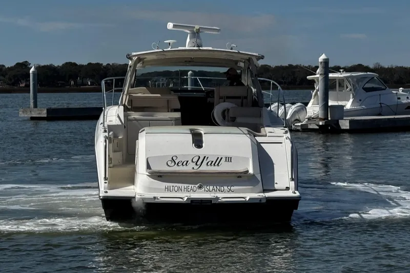 Slide: The Image of 2014 Pursuit SC 365i Sport Coupe boat docked at Hilton Head Island marina. - 3