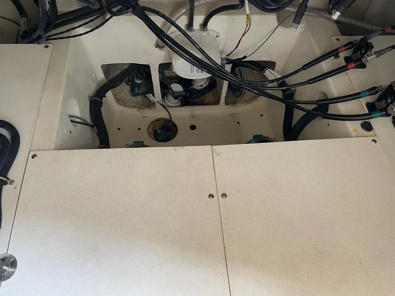 Slide: The Image of Engine compartment of 2014 Pursuit SC 365i Sport Coupe with visible wiring and components. - 35