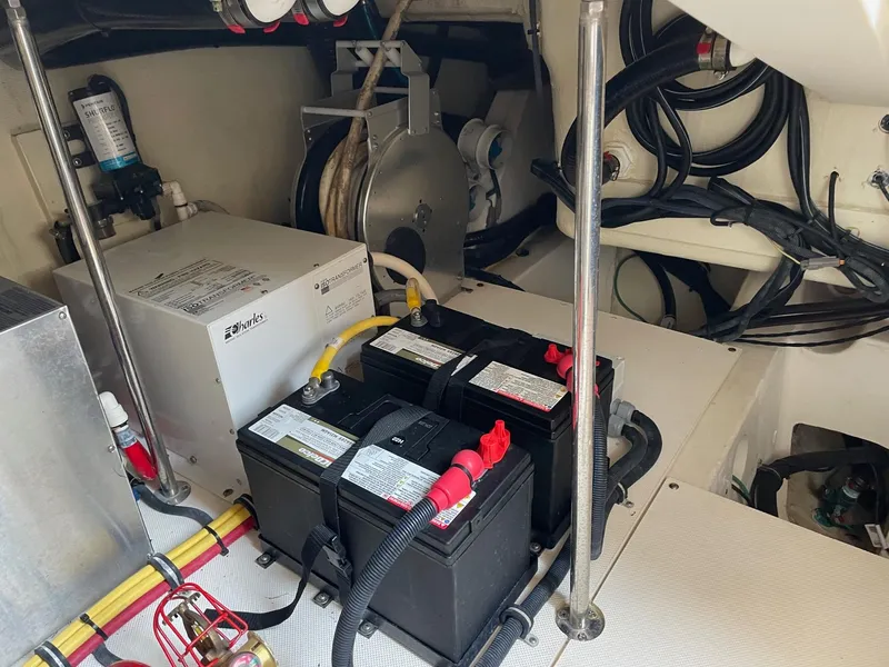 Slide: The Image of Engine room of 2014 Pursuit SC 365i Sport Coupe with batteries and wiring. - 38