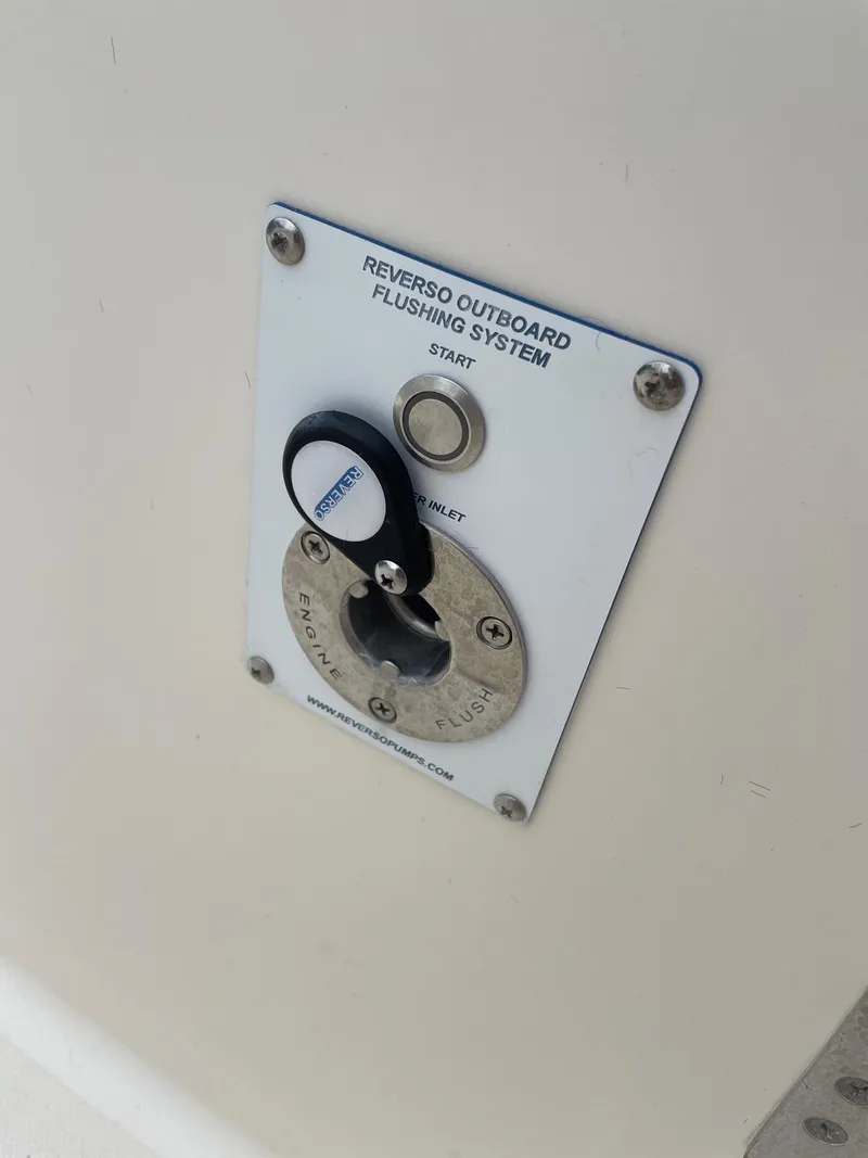 Slide: The Image of Reverso outboard flushing system on 2014 Pursuit SC 365i Sport Coupe. - 39