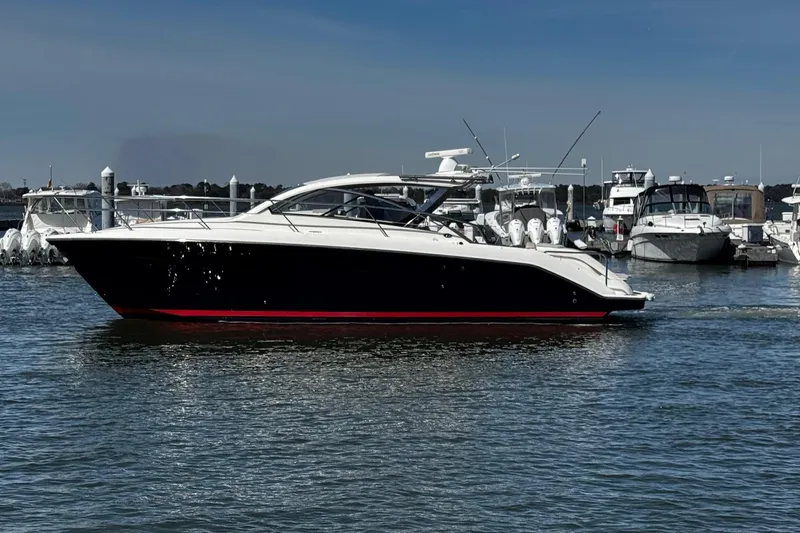 Slide: The Image of 2014 Pursuit SC 365i Sport Coupe yacht docked in a marina. - 6