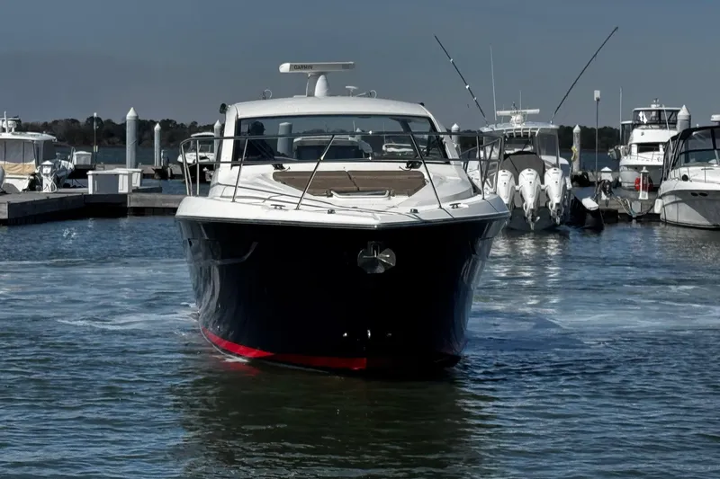 Slide: The Image of 2014 Pursuit SC 365i Sport Coupe yacht docked at marina. - 9