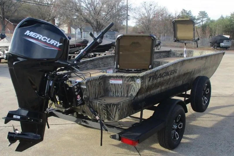 Slide: The Image of 2026 Tracker Grizzly 1650 T Prairie Wings Edition boat with Mercury engine on trailer. - 6