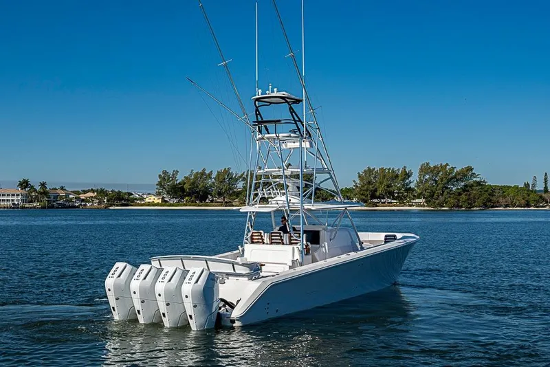 Slide: The Image of Luxury Sparks 46 boat, 2025 model, cruising on a serene blue lake under clear skies. - 100