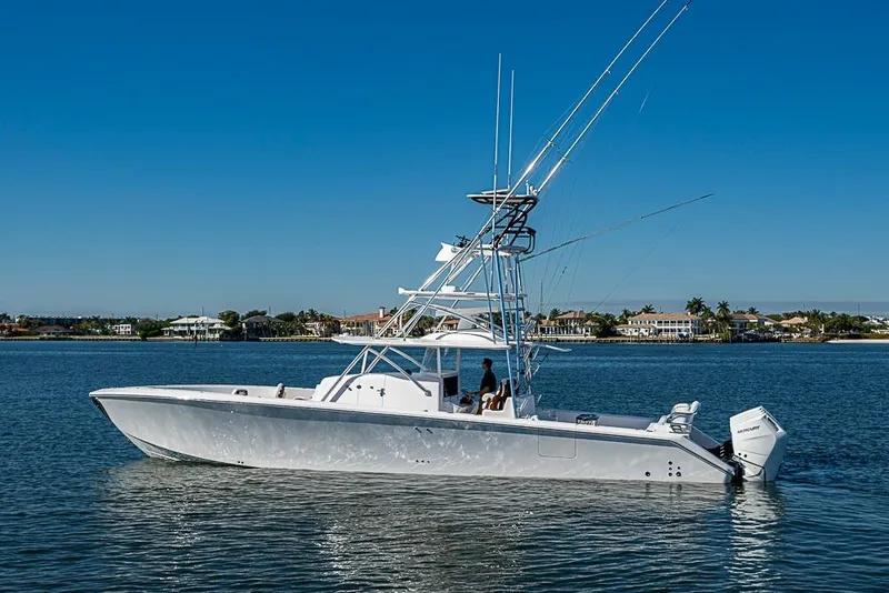 Slide: The Image of 2025 Sparks 46 boat on calm water with clear blue sky background. - 106