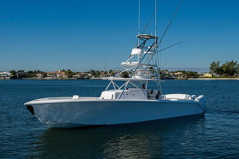 Slide: The Image of Sparks 46 boat, 2025 model, cruising on calm waters under clear blue sky. - 109