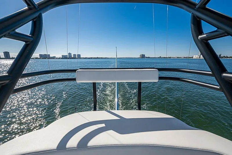 Slide: The Image of View from Sparks 46 boat, 2025 model, overlooking calm ocean and distant city skyline. - 118