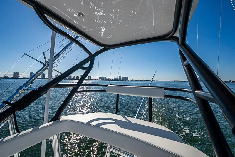 Slide: The Image of View from Sparks 46 boat, 2025 model, overlooking city skyline and ocean. - 119