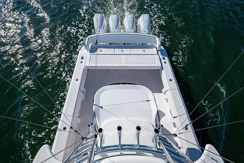 Slide: The Image of Aerial view of 2025 Sparks 46 boat with four engines on open water. - 120