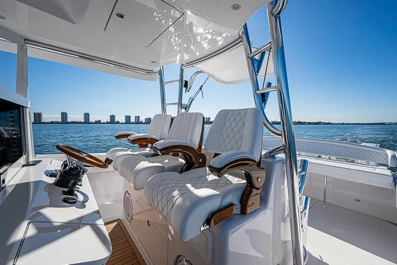 Slide: The Image of Luxurious Sparks 46 yacht interior, 2025 model, featuring elegant seating and ocean view. - 129