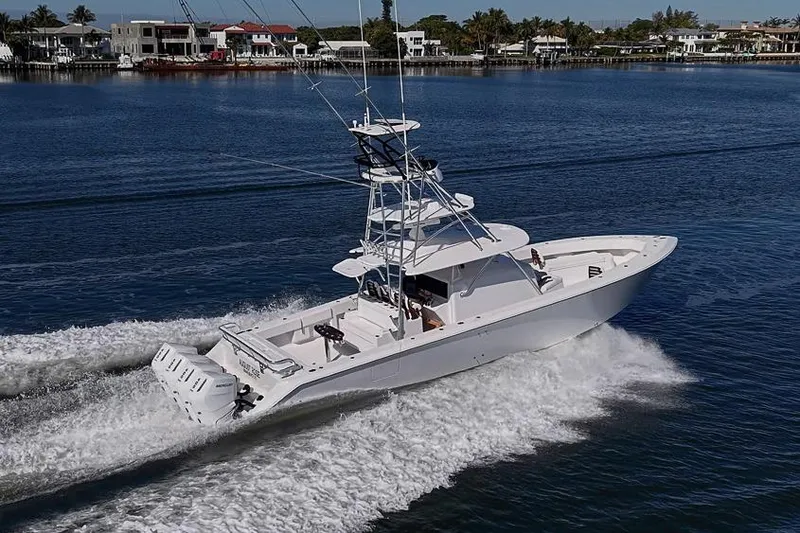 Slide: The Image of A sleek 2025 Sparks 46 yacht cruising on a calm waterway. - 15