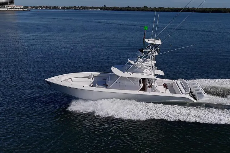 Slide: The Image of A 2025 Sparks 46 boat cruising on calm blue waters. - 19