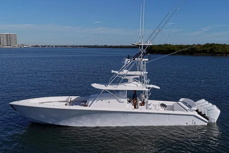 Slide: The Image of Sparks 46 yacht, 2025 model, cruising on calm waters under a clear blue sky. - 2