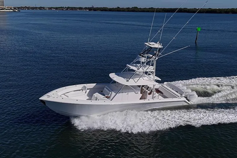 Slide: The Image of 2025 Sparks 46 boat cruising on a calm blue sea. - 20