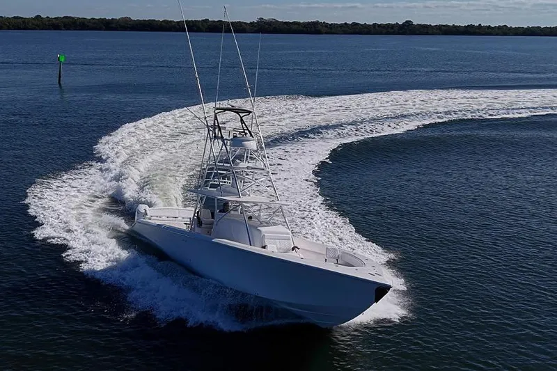 Slide: The Image of A 2025 Sparks 46 boat making a sharp turn on open water. - 23