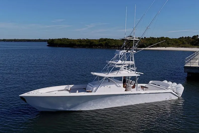 Slide: The Image of Sparks 46 yacht, 2025 model, cruising on a serene lake with clear blue skies. - 3