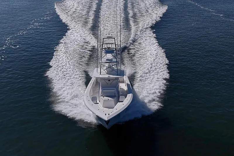 Slide: The Image of Aerial view of 2025 Sparks 46 boat cruising on open water. - 38