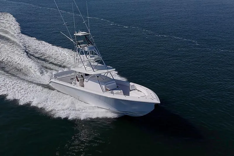 Slide: The Image of A 2025 Sparks 46 boat cruising swiftly on open water. - 39