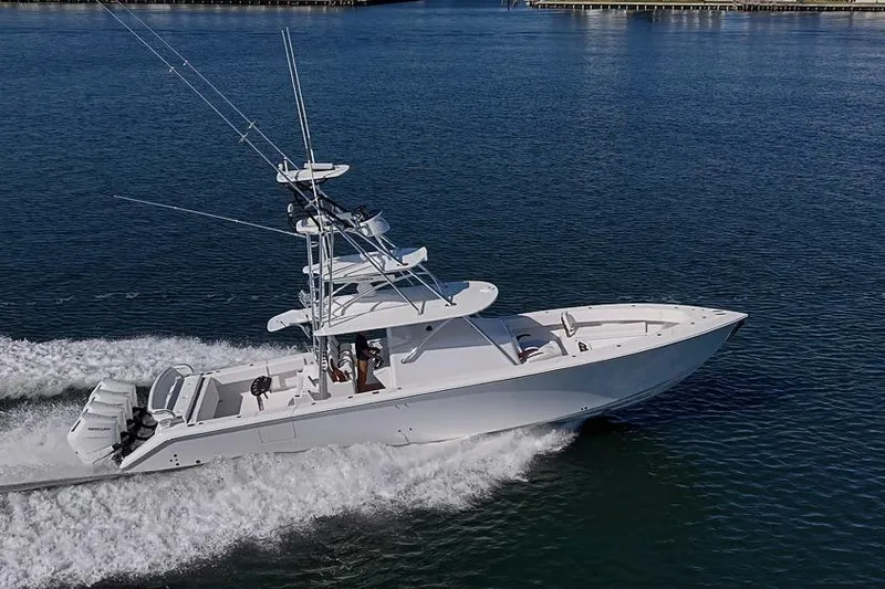 Slide: The Image of Sparks 46 boat cruising on water, 2025 model, sleek design, powerful engines. - 42