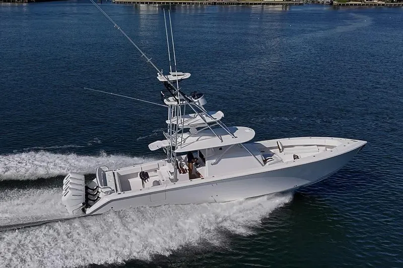 Slide: The Image of Sparks 46 boat cruising on water, 2025 model, with multiple outboard engines. - 43