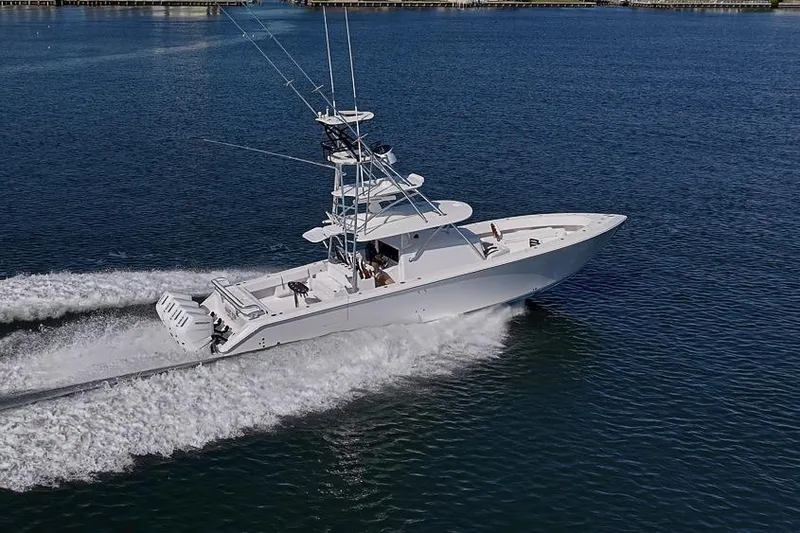 Slide: The Image of A 2025 Sparks 46 boat cruising on open water, showcasing sleek design and powerful performance. - 44