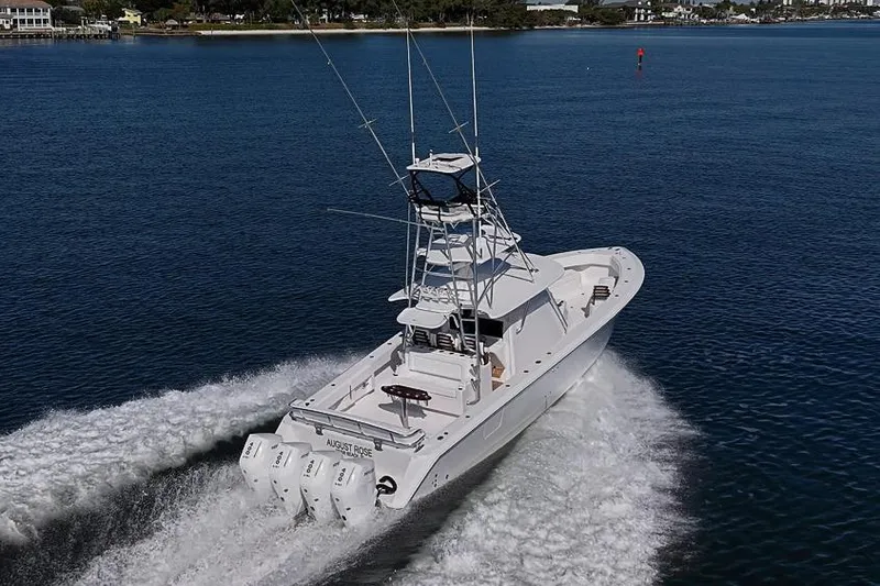 Slide: The Image of Sparks 46 boat cruising on water, 2025 model, with triple engines and tower. - 46