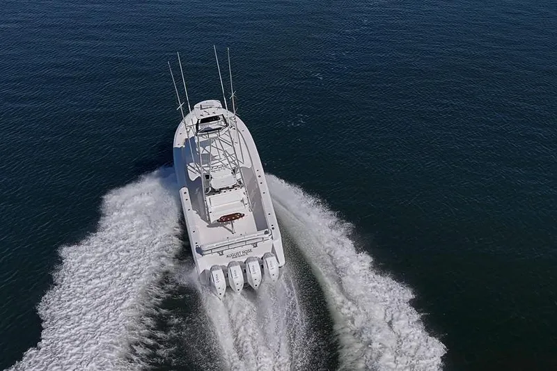 Slide: The Image of Aerial view of 2025 Sparks 46 boat cruising on open water. - 50