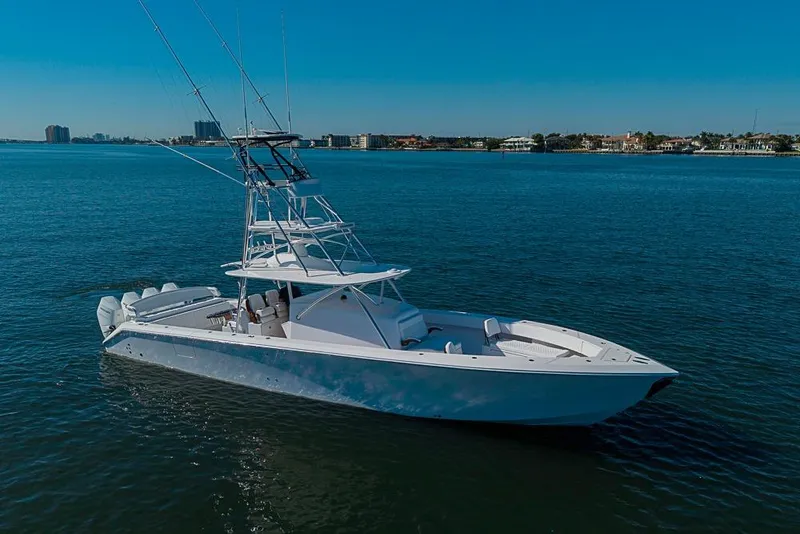 Slide: The Image of A 2025 Sparks 46 yacht cruising on calm blue waters under a clear sky. - 52