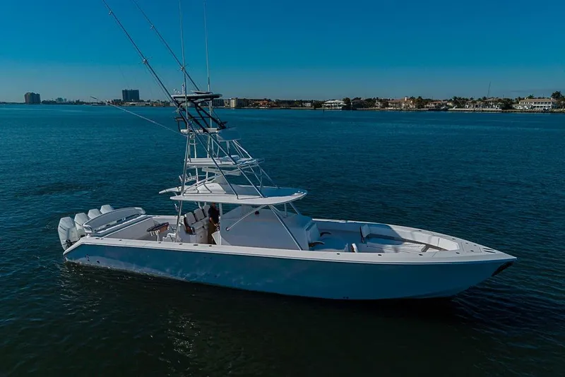 Slide: The Image of Sparks 46 yacht, 2025 model, cruising on calm blue waters under a clear sky. - 53