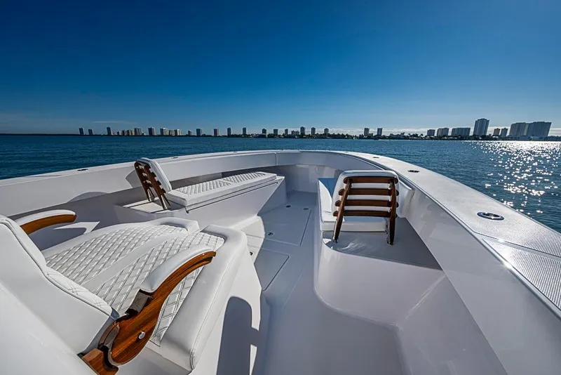 Slide: The Image of Luxurious Sparks 46 boat, 2025 model, with elegant seating, cruising on a sunny day. - 58