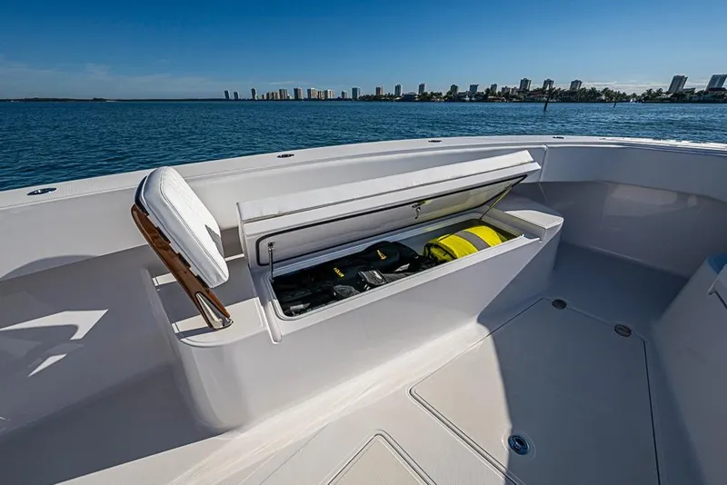 Slide: The Image of Open storage compartment on Sparks 46 boat, 2025 model, with ocean view and city skyline. - 64