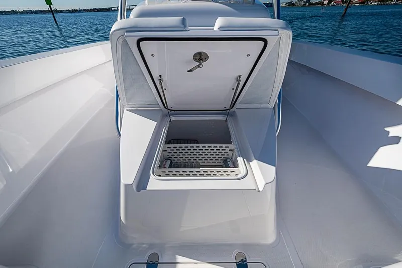 Slide: The Image of Open storage compartment on Sparks 46 boat, 2025 model, with ocean view background. - 69