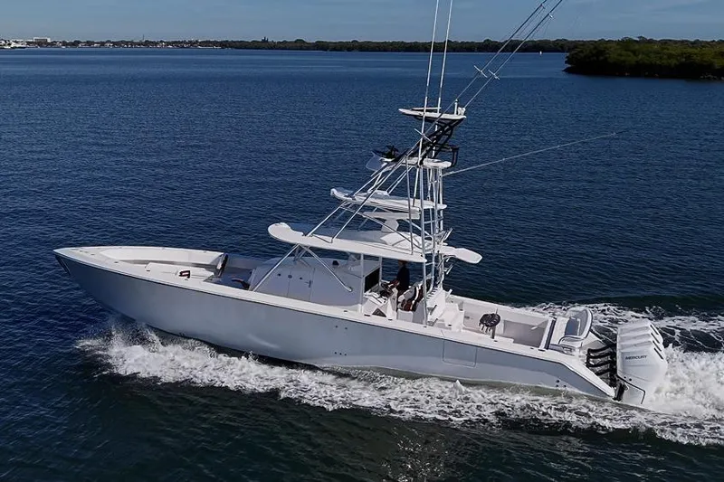 Slide: The Image of 2025 Sparks 46 boat cruising on open water, showcasing sleek design and powerful engines. - 7