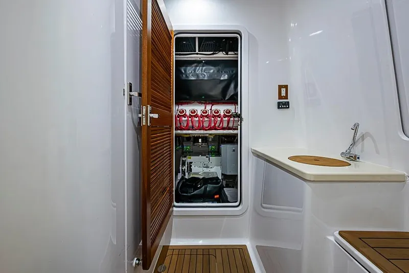 Slide: The Image of Interior of 2025 Sparks 46 yacht with open wooden door and modern sink. - 74